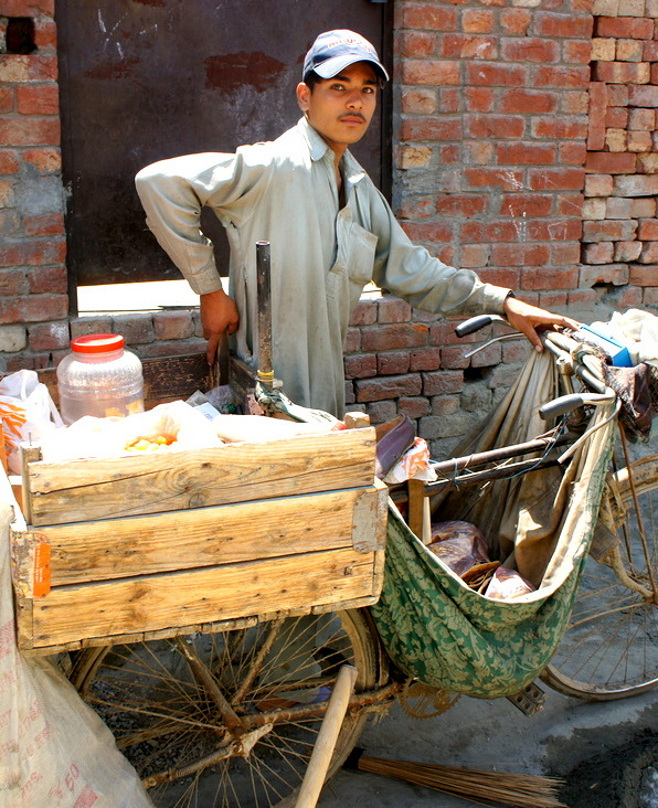 Boy selling snaks a village street 001